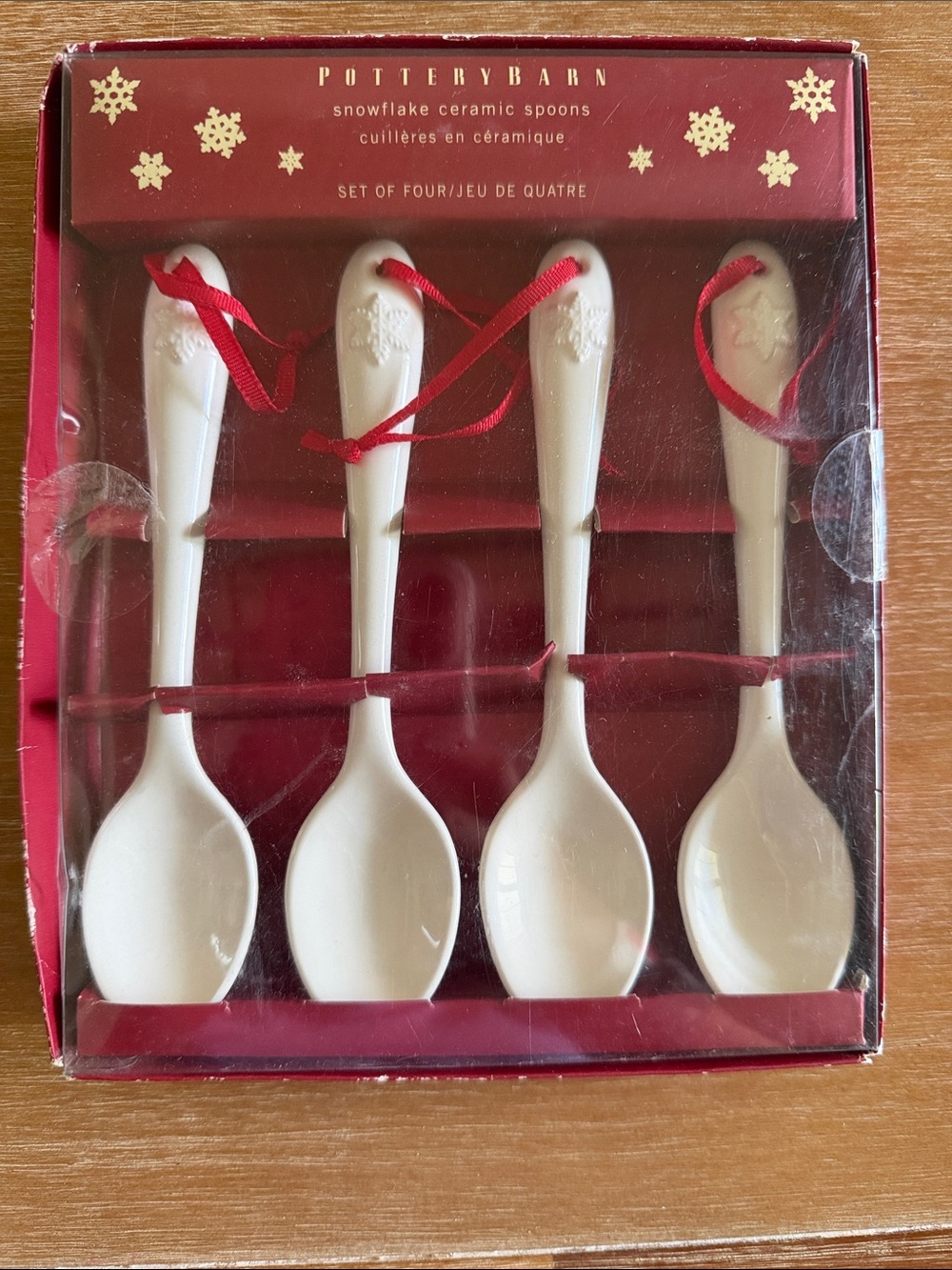 Pottery Barn White Ceramic Snowflake Spoons with Red Ribbon Set